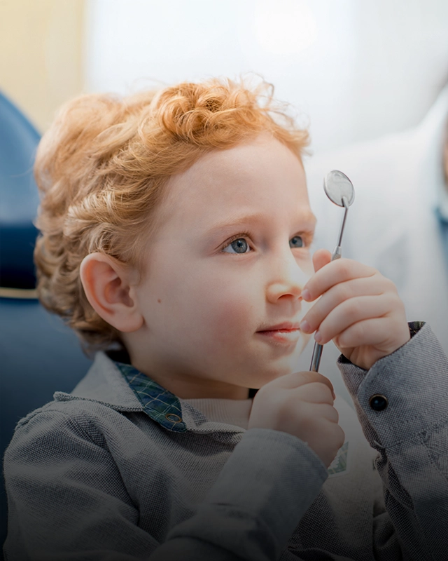 Curious Boy In Dental Chair