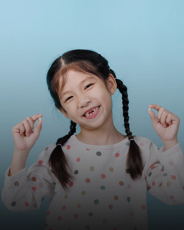 Young Girl With Pigtails Smiling